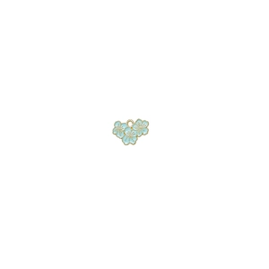 Macro detail of a light blue enamel flower pendant with gold edges and a top loop