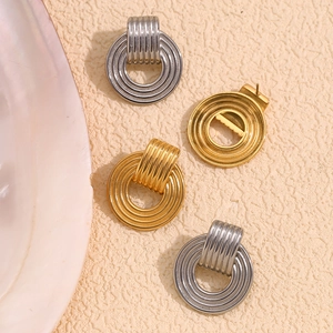 Classic 18K gold and silver retro textured hoop earrings set on aesthetic background