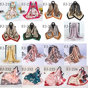 Detailed collection of 16 satin silk square scarves with floral and geometric patterns