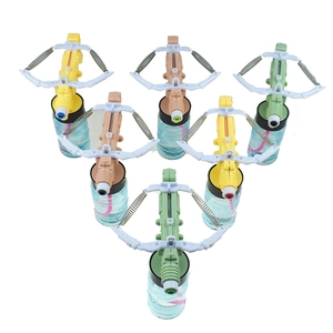 Detail of 6-piece plastic crossbow bubble toy set in yellow, green and brown colors