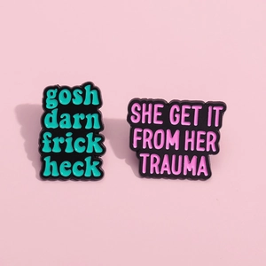 Creative enamel pins set with humor quotes in mint green and pink on black base