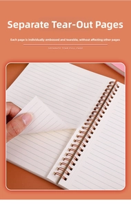 Detail of A5 spiral notebook featuring rose gold wire binding and easy-tear perforated pages