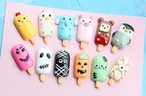 Flat lay of colorful resin popsicle charms in animal and Halloween themed DIY designs