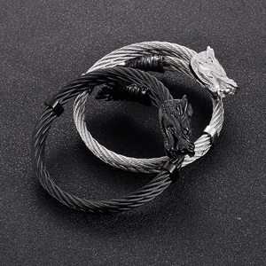 Detailed close-up of silver and black punk dragon head wire bangles for men