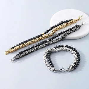 Detail of beaded black agate and stainless steel Byzantine chain bracelet for men
