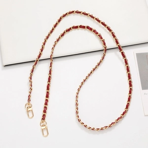 Detail of burgundy leather woven with gold metal chain strap and lobster clasps