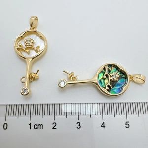 Baroque 18K gold-plated abalone shell rose flower key charms with size ruler display