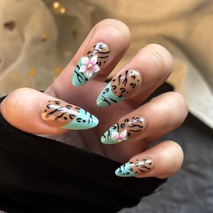 Mint green and nude almond press-on nails with leopard patterns and 3D floral accents