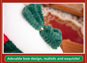 Close-up of plush dark green bow with golden ring detail on white faux fur base