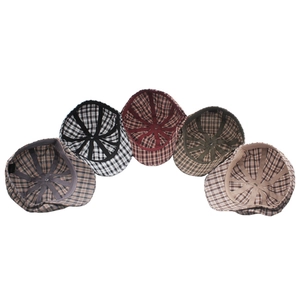 Detail of five cotton plaid newsboy caps showing inner lining and sweatband construction
