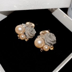 Detail of vintage flower earrings with champagne pearls and sparkling crystals