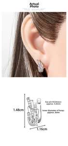 Detailed view of silver angel wing earrings with dimensions 1.48cm by 1.16cm