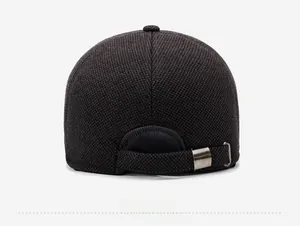 Detail of adjustable metal buckle and textured wool fabric on the winter baseball cap
