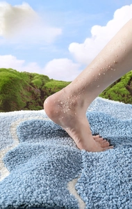 Close-up of thick microfiber bath mat with high water absorption and tufted texture