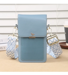 Detail of light blue PU leather phone bag with gold grass clasp and bohemian wide strap