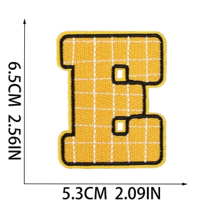 Size details of the yellow embroidered letter E patch measuring 6.5cm x 5.3cm on white