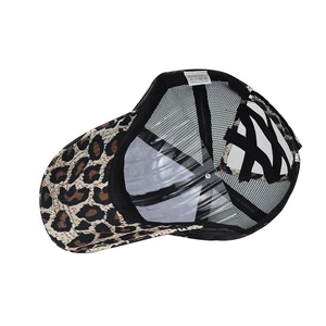Detail view of leopard print baseball cap with cross elastic bands for ponytails