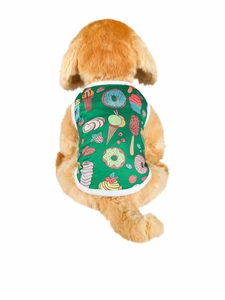 Detail of green summer dog vest featuring colorful dessert prints on a plush model