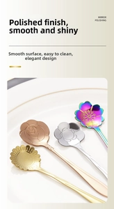 Detailed close-up of mirror-polished flower-shaped stainless steel spoons on white ceramic