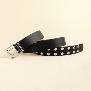 Detail of black leather belt with double silver buckles and dual row metal eyelets