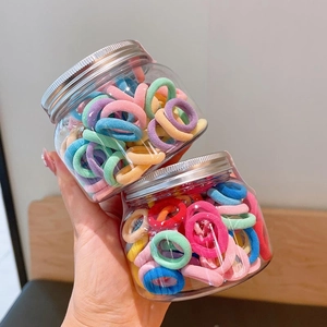 Two jars of colorful high-elasticity hair ties for kids in macaron shades
