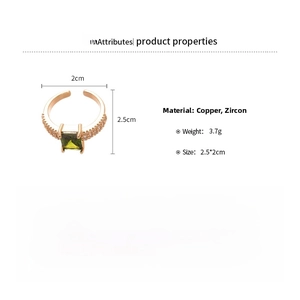 Detail view of 18k gold plated copper ring with green zircon and side pave stones