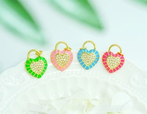 Detailed view of colorful enamel heart lock pendants with micro-pave cubic zirconia