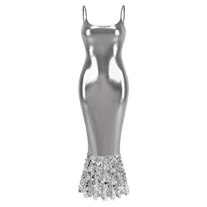 Detail of silver metallic slim dress featuring a sequined mermaid hemline and thin straps