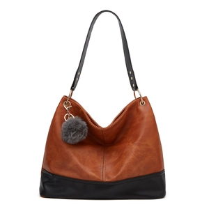 Minimalist large-capacity color-block tote bag in brown and black with fur ball pendant
