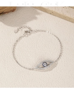 Detail of S925 sterling silver evil eye bracelet with blue zircon and pavé setting