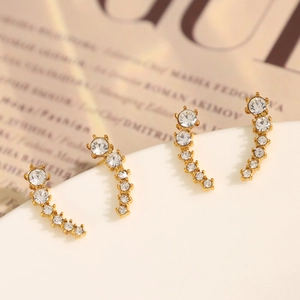 Minimalist gold crescent moon stud earrings featuring graduated clear zircon crystals