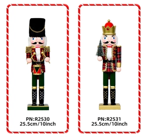 Detail showing 25.5cm wooden nutcracker soldiers with glitter drums and Christmas tree
