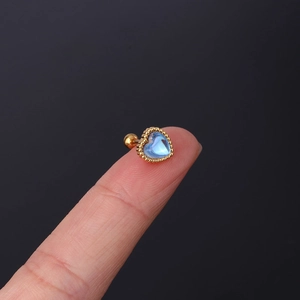 Sky blue heart moonstone stud earring with gold stainless steel screw back on finger