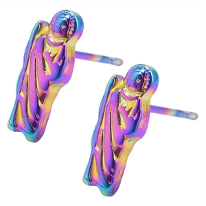 Macro view of religious figure stud earrings with iridescent metallic plating finish