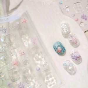 3D embossed ocean nail stickers with iridescent starfish and shell patterns in blue