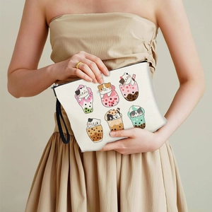 Canvas makeup bag featuring cartoon cats in boba tea cups with a black wrist strap