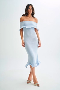 Detail of light blue off-shoulder knitted dress showing ruffled neckline and hem texture