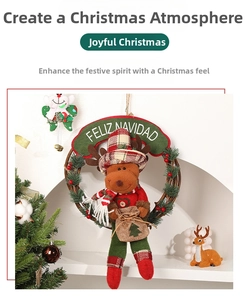 Detailed Christmas wreath featuring a plush reindeer doll with a Feliz Navidad banner