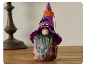 Detail of Halloween gnome hanging ornament with purple wizard hat and orange plaid body