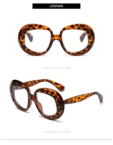 Detailed close-up of retro oversized leopard print sunglasses from multiple angles