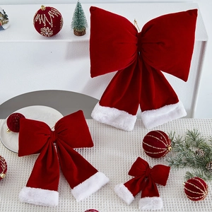 Red velvet Christmas bows with white faux fur trim in various sizes for festive decor