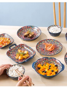 Detail view of Bohemian ceramic tableware set serving meals with vibrant mandala patterns
