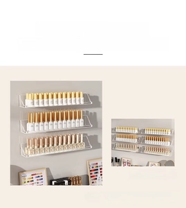 Close-up of a wall-mounted clear acrylic shelf for nail polish bottles and displays