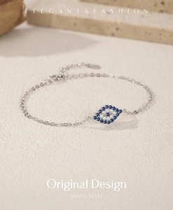 Macro shot of S925 silver Evil Eye bracelet with blue and white pavé cubic zirconia