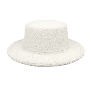 Detailed macro view of white faux shearling texture on a flat top wide brim winter hat