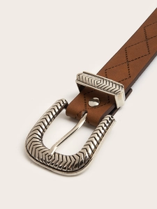 Close-up of brown leather belt with vintage floral engraved buckle and diamond stitching