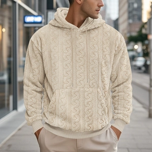 Detail of men's beige teddy fleece hoodie showing braided knit texture and thick fabric
