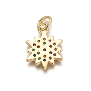 Macro shot of an 18K gold star pendant with colorful crystals and a connector ring