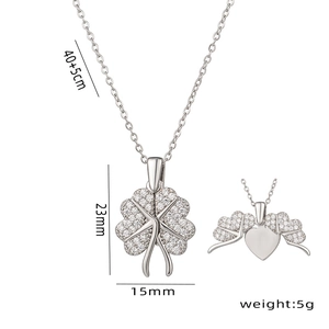 Silver four-leaf clover pendant necklace with heart wings and crystal inlay design