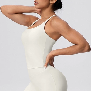 Close-up of beige high-elastic sports bra with thin straps and ribbed texture